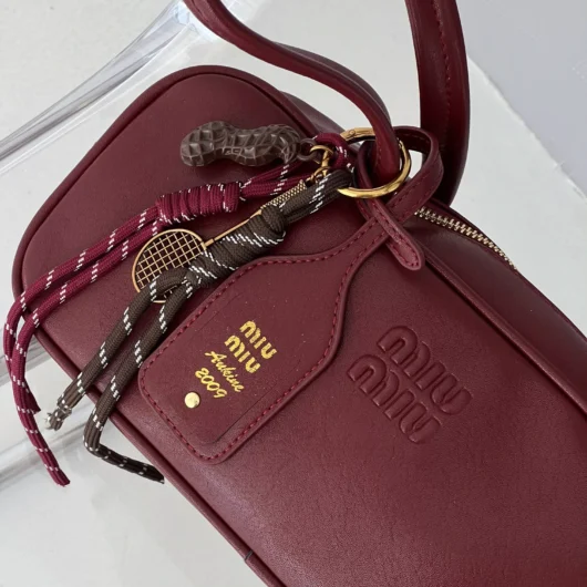 Сумка Miu Miu багет з брелком бордовий
